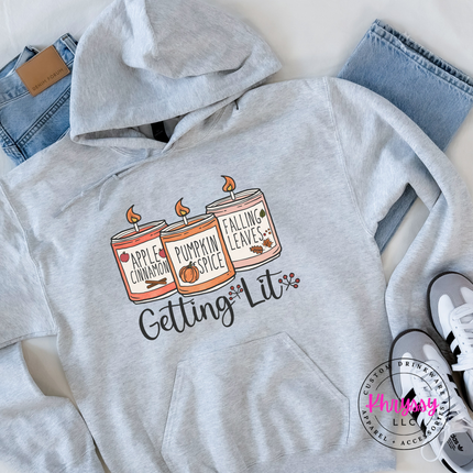 Ash hoodie with the Getting Lit fall candles graphic