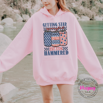 Light Pink pullover hoodie showing a retro Americana beer-can graphic in navy and red.