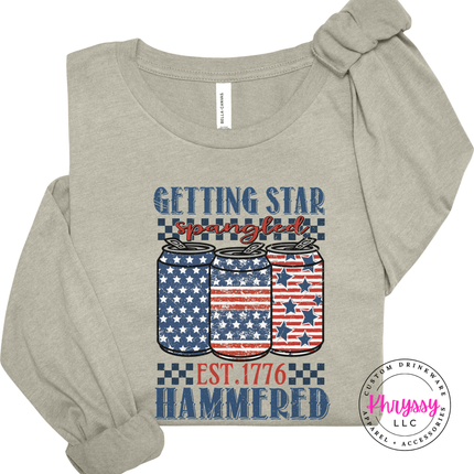 Heather Stone long sleeve tee with a faded star-spangled hammered beer-can design.