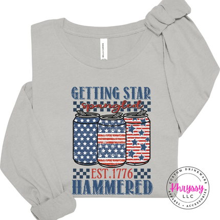 Silver long sleeve tee displaying a vintage patriotic beer-can graphic with white stars.