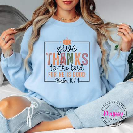 Light Blue crewneck sweatshirt with the faith based give thanks scripture graphic
