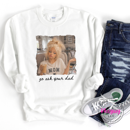 White sweatshirt with graphic design and text, paired with jeans and sneakers on a white background.