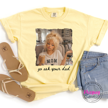 Yellow t-shirt with graphic design and text, paired with sandals and shorts on a white background.