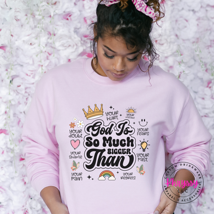 Light Pink crewneck sweatshirt with an encouraging God Is So Much Bigger Than graphic.