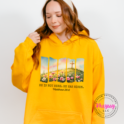 Gold pullover hoodie featuring a watercolor He Is Not Here He Has Risen design.