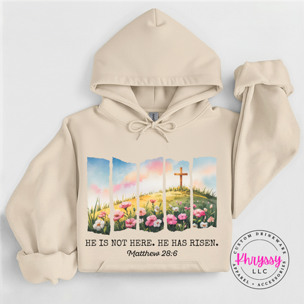 Sand pullover hoodie displaying a He Has Risen cross and wildflowers design.