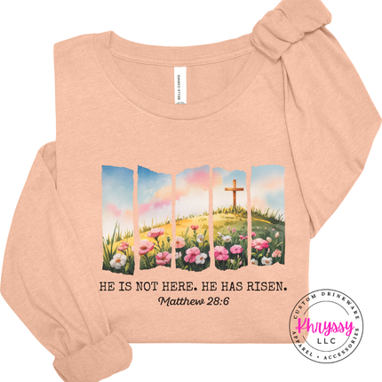 Heather Peach long sleeve tee showing a He Has Risen cross and flowers print.
