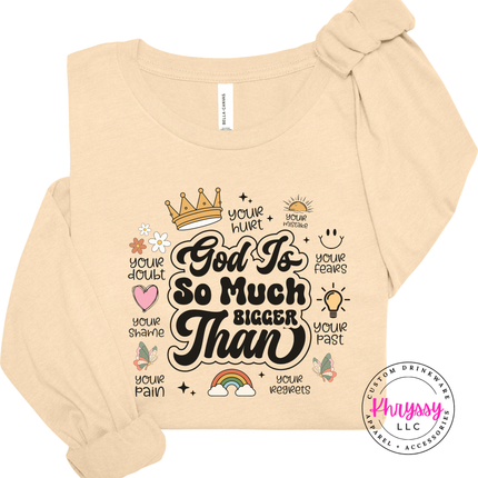 Soft Cream long sleeve tee with an encouraging God Is So Much Bigger Than graphic.