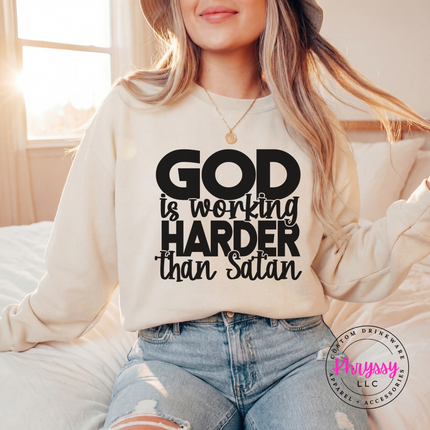 Sand crewneck sweatshirt showing a bold black faith and humor graphic