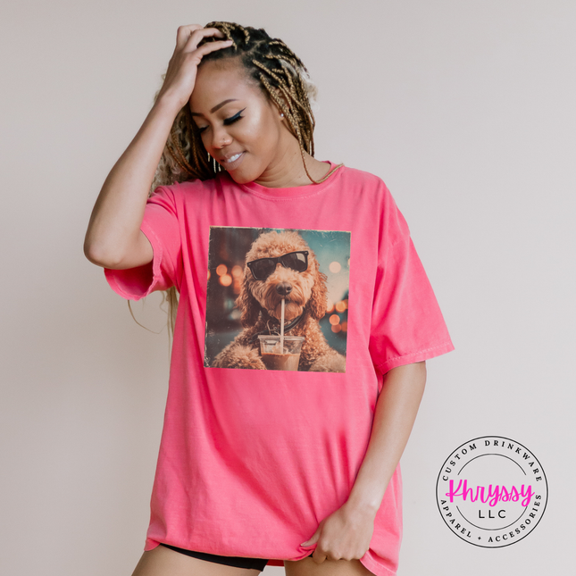Woman wearing a pink t-shirt with a dog graphic, standing against a plain background.