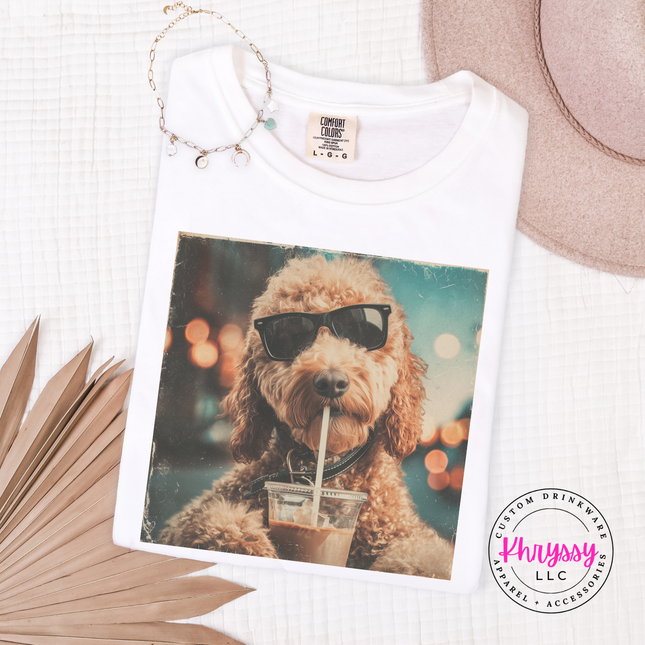 White t-shirt with a dog wearing sunglasses and drinking iced coffee graphic, branded 'Phrysy'.