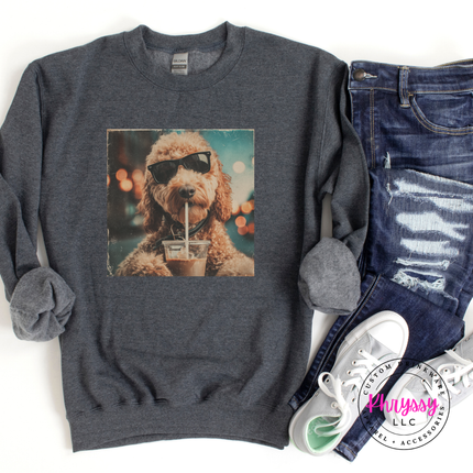 Gray sweatshirt with a dog wearing sunglasses and a cup design, paired with jeans and sneakers on a white background.