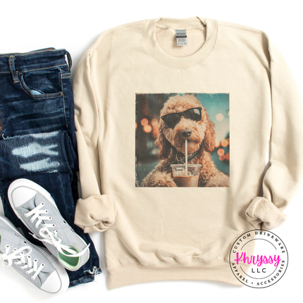 Beige sweatshirt with a dog graphic, paired with jeans and sneakers on a white background.