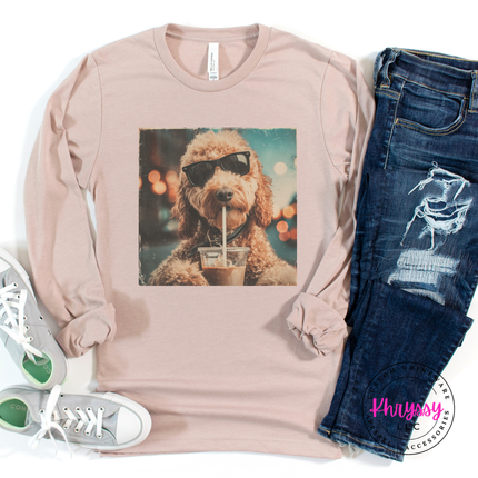 Soft cream long-sleeve shirt with a dog graphic, paired with jeans and sneakers on a white background.