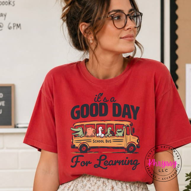 Red colored shirt featuring Good Day For Learning bus graphic.