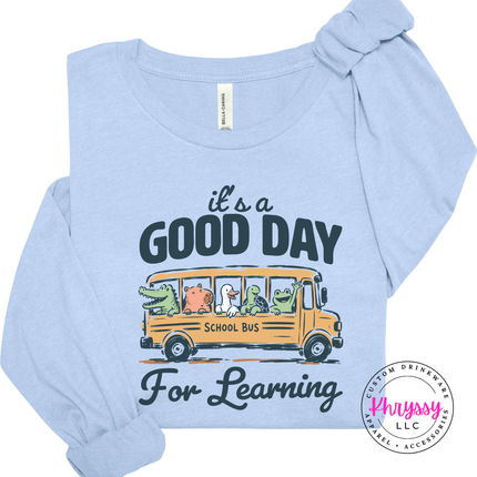 Light blue lightweight shirt featuring Good Day For Learning graphic.