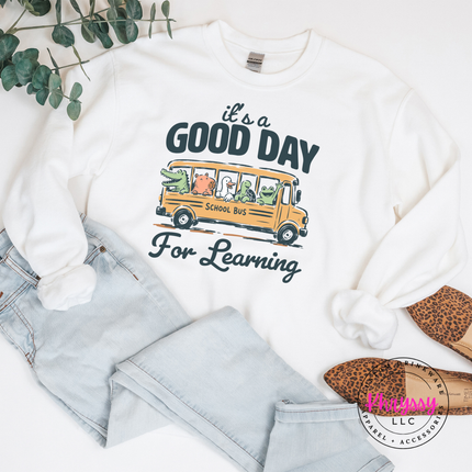 White heavyweight crewneck with vintage school bus animal design.