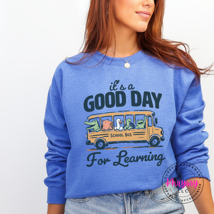 heather sport dark navy sweatshirt with muted alligator and turtle bus print.