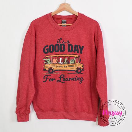 Heather sportk scarlet sweatshirt with muted alligator and turtle bus print.