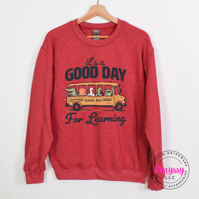 Heather sportk scarlet sweatshirt with muted alligator and turtle bus print.