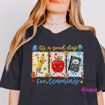 Charcoal gray tee with a colorful pencil, apple, and notebook school design.