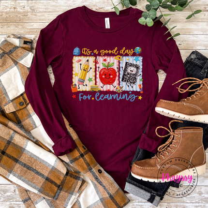 Maroon lightweight teacher shirt with Good Day For Learning graphic.