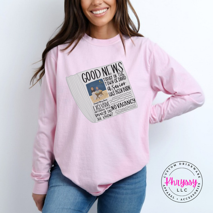 Blossom long sleeve tee featuring a vintage Good News nativity newspaper.