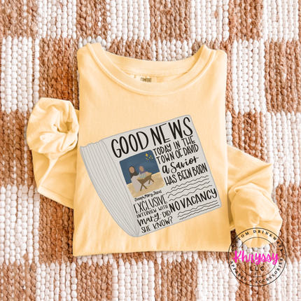 Model wearing the Good News nativity long sleeve tee in Butter.