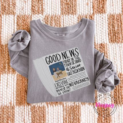 Flat lay of the Good News nativity Christmas long sleeve tee in Gray.