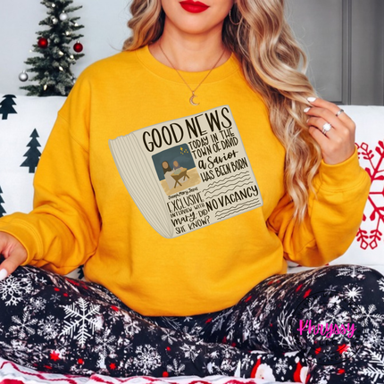 Close up of the Good News nativity art on a Gold crewneck sweatshirt.