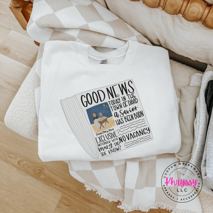 Flat lay of the Good News nativity Christmas crewneck sweatshirt in White.