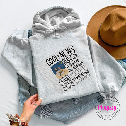 Ash hoodie featuring a vintage Good News nativity newspaper.