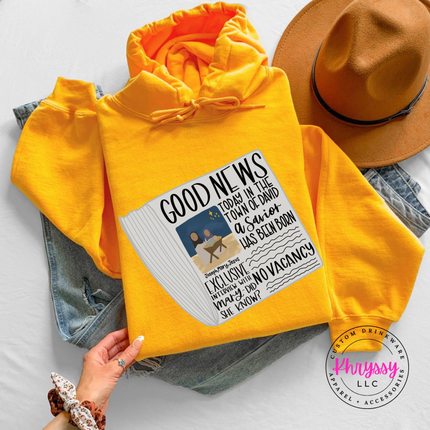 Close up of the Good News nativity art on a Gold hoodie.