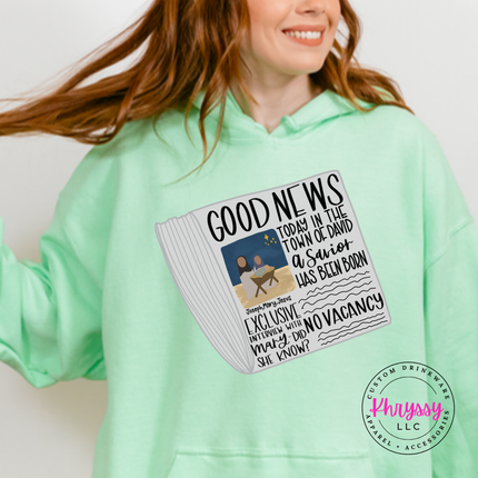 Mint Green hoodie featuring a vintage Good News nativity newspaper.