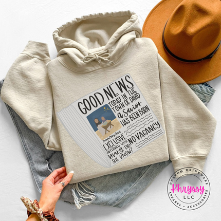 Close up of the Good News nativity art on a Sand hoodie.