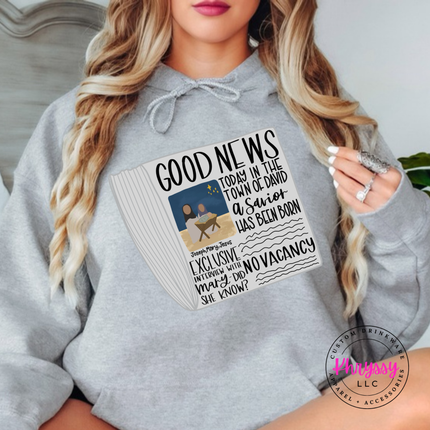 Sport Gray hoodie showing a Good News newspaper with a nativity photo.