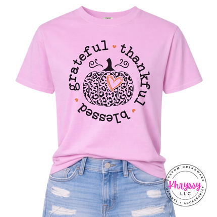 Rose Quartz tee with a hand-illustrated leopard pumpkin and heart design.