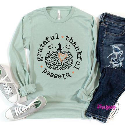 Mint colored top with a hand-illustrated leopard pumpkin and heart design.