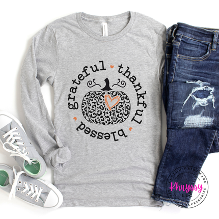 Athletic grey tee styled with jeans, featuring a grateful thankful blessed print.