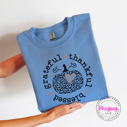 Carolina Blue crewneck sweatshirt with the leopard pumpkin grateful thankful blessed design