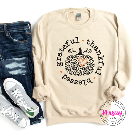 Sand colored crewneck sweatshirt featuring a grateful thankful blessed print.