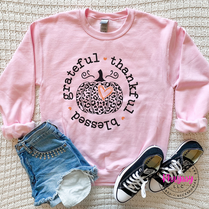 Light Pink crewneck sweatshirt with the grateful thankful blessed leopard pumpkin graphic