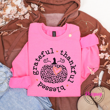 Safety Pink crewneck sweatshirt with the thankful and blessed circle pumpkin graphic