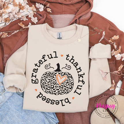 Sand crewneck sweatshirt with the grateful thankful blessed leopard pumpkin graphic