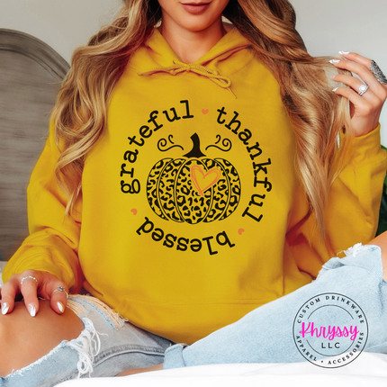 Gold hoodie with the thankful and blessed circle pumpkin graphic