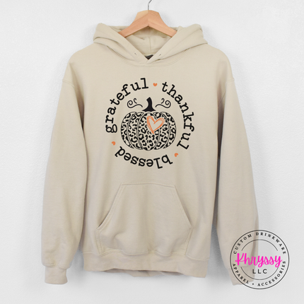 Sand hoodie featuring a grateful thankful blessed pumpkin illustration.