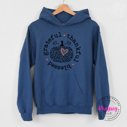 Indigo blue pullover hoodie with a hand-illustrated leopard pumpkin design.