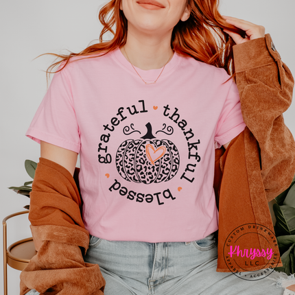 Woman wearing a Blossom tee with the leopard pumpkin grateful thankful blessed design