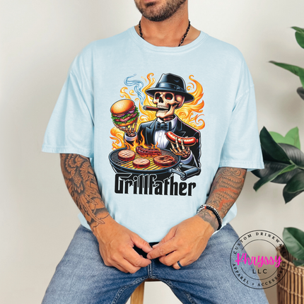 Chambray Comfort Colors tee showing a cigar-smoking skeleton at a flaming BBQ grill.