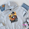 Ash Grey hoodie with a suited skeleton grilling under the Grillfather title.